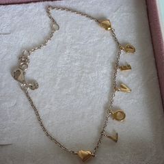 Pandora chain bracelet with gold yellow plated hearts, and dangle letters spelling LOVE adjustable closure with three length options: 16 cm, 18 cm, and 20 cm. In good condition few signs of wear.