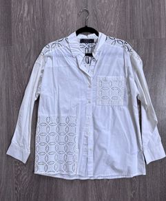 New stylish white button-up blouse, a crisp cotton intricate cutwork (broderie anglaise) panels
