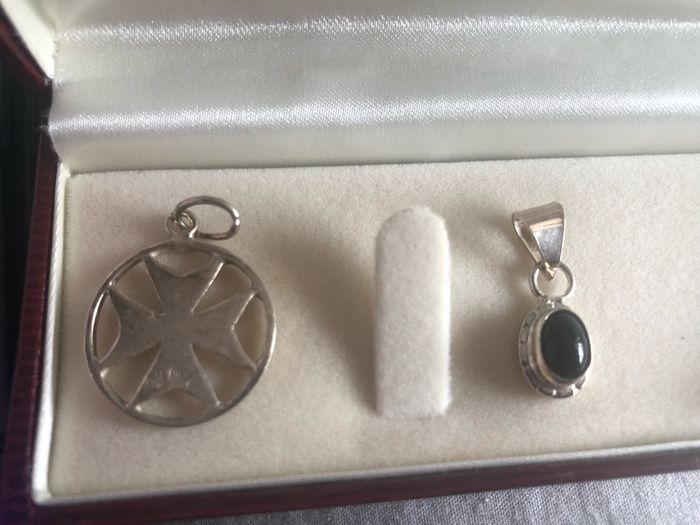 4 silver pendents