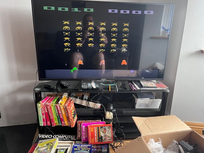 Atari 2600 Space Invaders Woody Atari 2600 with 15 individual games and 14 game Indy 500 driving