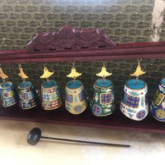 Enamel cloisonne graduated bells on wooden stand