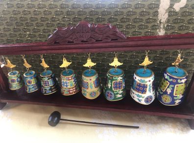 Enamel cloisonne graduated bells on wooden stand