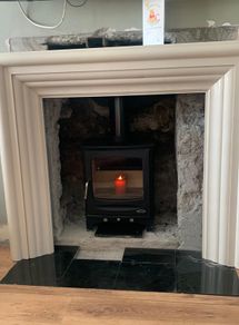 Cream marble fireplace/stove surround