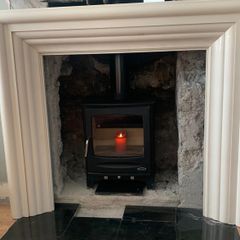 Cream marble fireplace/stove surround