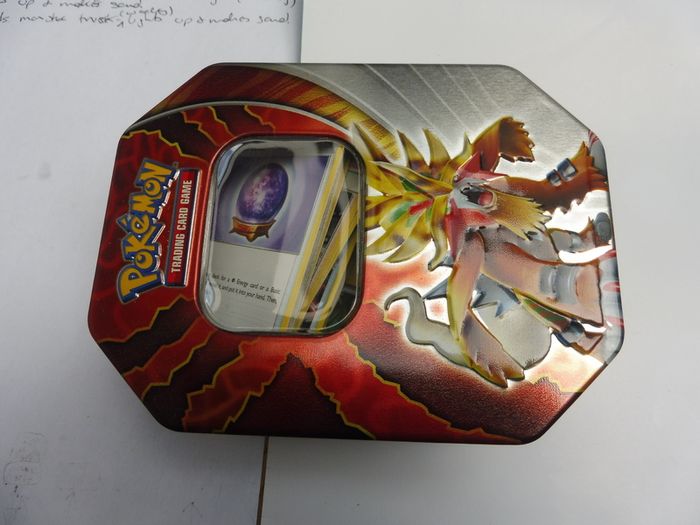 Pokemon Trading Card Game Gouging Fire tin box with bulk cards