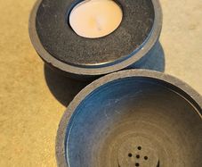 A cast with marble insert  4-in-1  paper wight ,candle holder, tea light holder, and A incense holder designed ball.