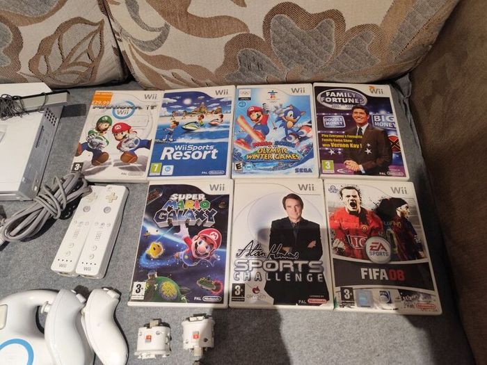 Wii bundle with Mario kart, Sports Resort, Mario Galaxy, Mario & Sonic Olympic