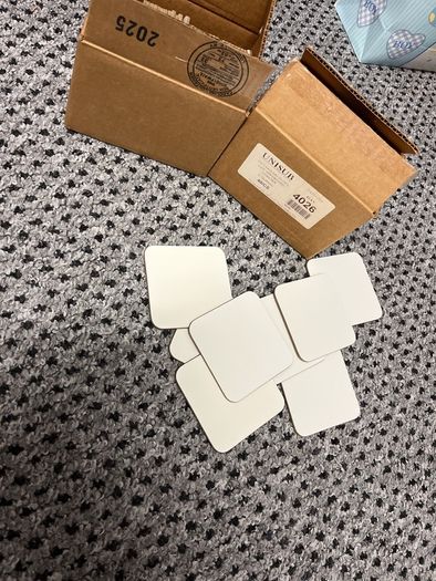 Coasters, plain white, new in box, about sixty five