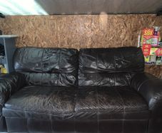 Dark brown leather sofa and matching armchair