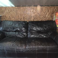 Dark brown leather sofa and matching armchair