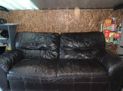 Dark brown leather sofa and matching armchair
