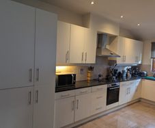 Kitchen with black granite worktop