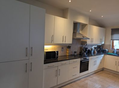 Kitchen with black granite worktop