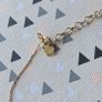 925 sterling silver bracelet with yellow gold plating and V shaped pendant. Image 5