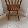 1 x vintage solid pine farmhouse kitchen chair featuring a classic Windsor-inspired spindle back design. Image 2