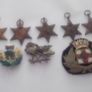 6  2an world war  medals the 1939 to 1945 star i cap badge and badge with a lion on it and enamel badge Image 4