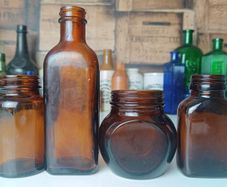 471 - Set of 4 Vintage Amber Glass Screw Top Collectible Decorative Bottles