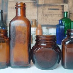 471 - Set of 4 Vintage Amber Glass Screw Top Collectible Decorative Bottles
