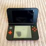 New Nintendo 3DS XL Orange and Black Image 6