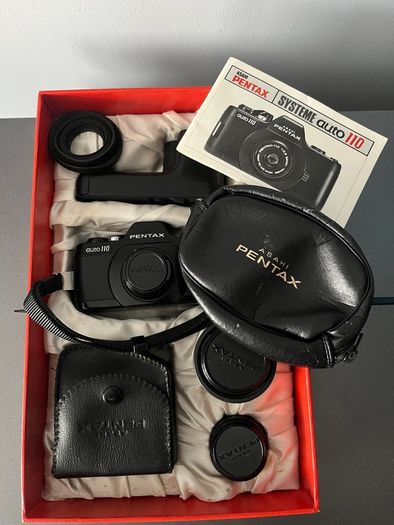 3 Pentax Auto 110 film cameras and accessories boxed