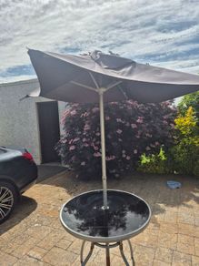 Garden table and parasol