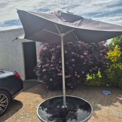 Garden table and parasol