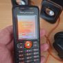 Sony Ericsson W200i , with charger and speakers. Image 2