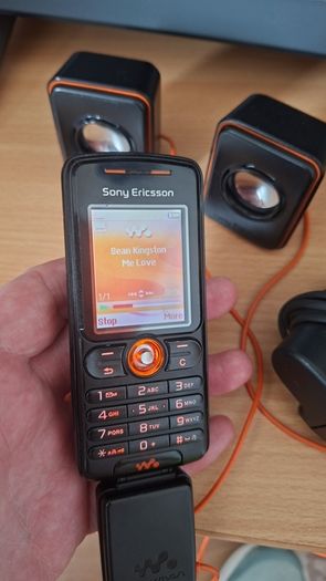 Sony Ericsson W200i , with charger and speakers.