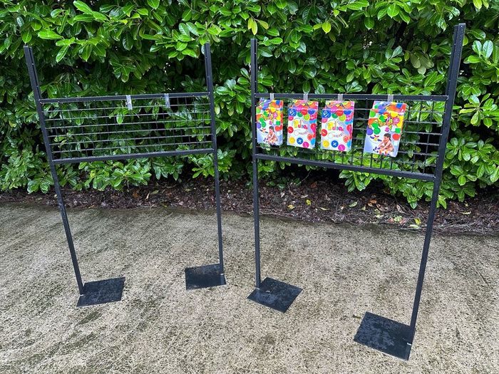 Black Grid Wall Shop Display Stand - Signage Space Above
