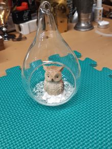 Owl ornament in glass container