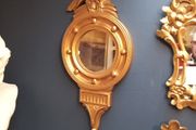 Antique gilt wall mirror  eagle pediment.