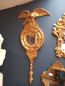 Antique gilt wall mirror  eagle pediment.