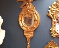 Antique gilt wall mirror  eagle pediment.