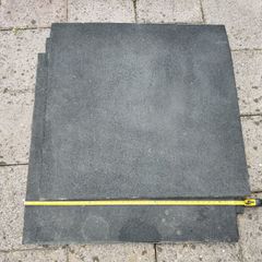 Three used 20mm thick 1m x 1m rubber gym floor mats