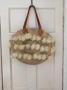 Straw basket bag with leather handles
