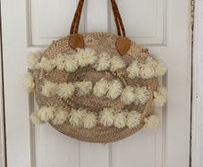 Straw basket bag with leather handles