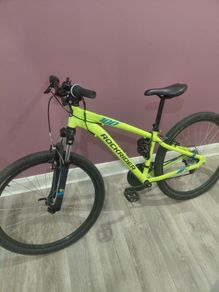 This is a yellow Decathlon Rockrider mountain bike