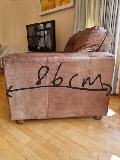 brown leather sofa and arm chair
