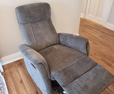 Swivel rocker reclining armchair