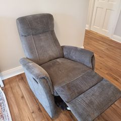 Swivel rocker reclining armchair