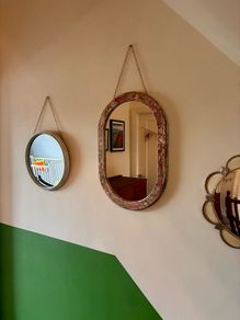 Distressed oval mirror