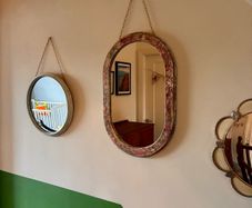 Distressed oval mirror