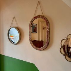 Distressed oval mirror