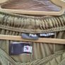New FILA olive green athletic track pants with an elastic drawstring waistband and zippered ankle hems. Image 3
