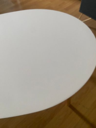 Oval white coffee table with wooden legs