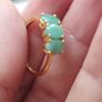 A trilogy ring for women with emeralds and 925 sterling silver in gold plated,TJC.. Image 8