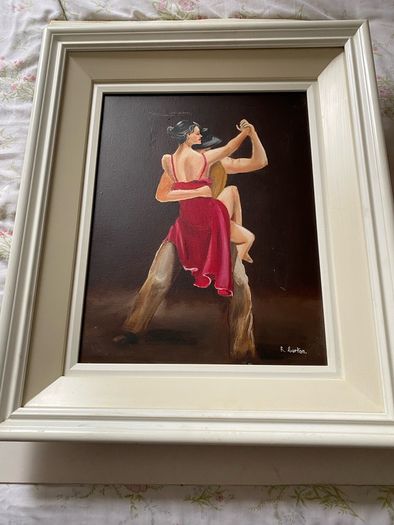 A dramatic figurative painting of two tango dancers