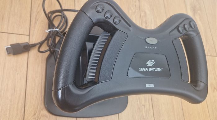 Sega Saturn w/ 3D Control Pad, Arcade Racer, Lightgun and Games