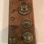Antique brass weights in original wooden stands Image 2