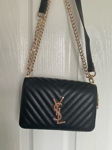 Black quilted flap shoulder bag with gold hardware